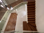 Detail view of Pacific Spotted Gum SPC Herringbone 9.5mm herringbone flooring sample
