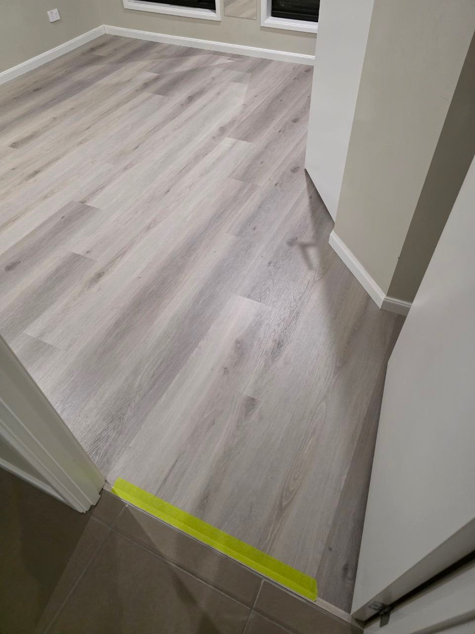 Installed room view of Snow Grey SPC 9.5mm SPC hybrid flooring sample