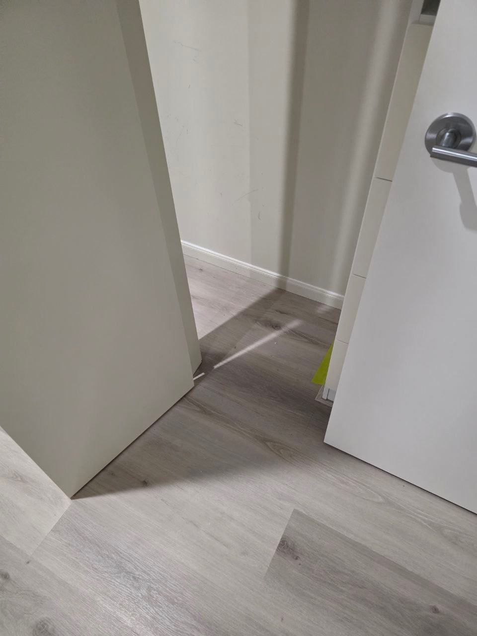 Installed room view of Snow Grey SPC 9.5mm SPC hybrid flooring sample