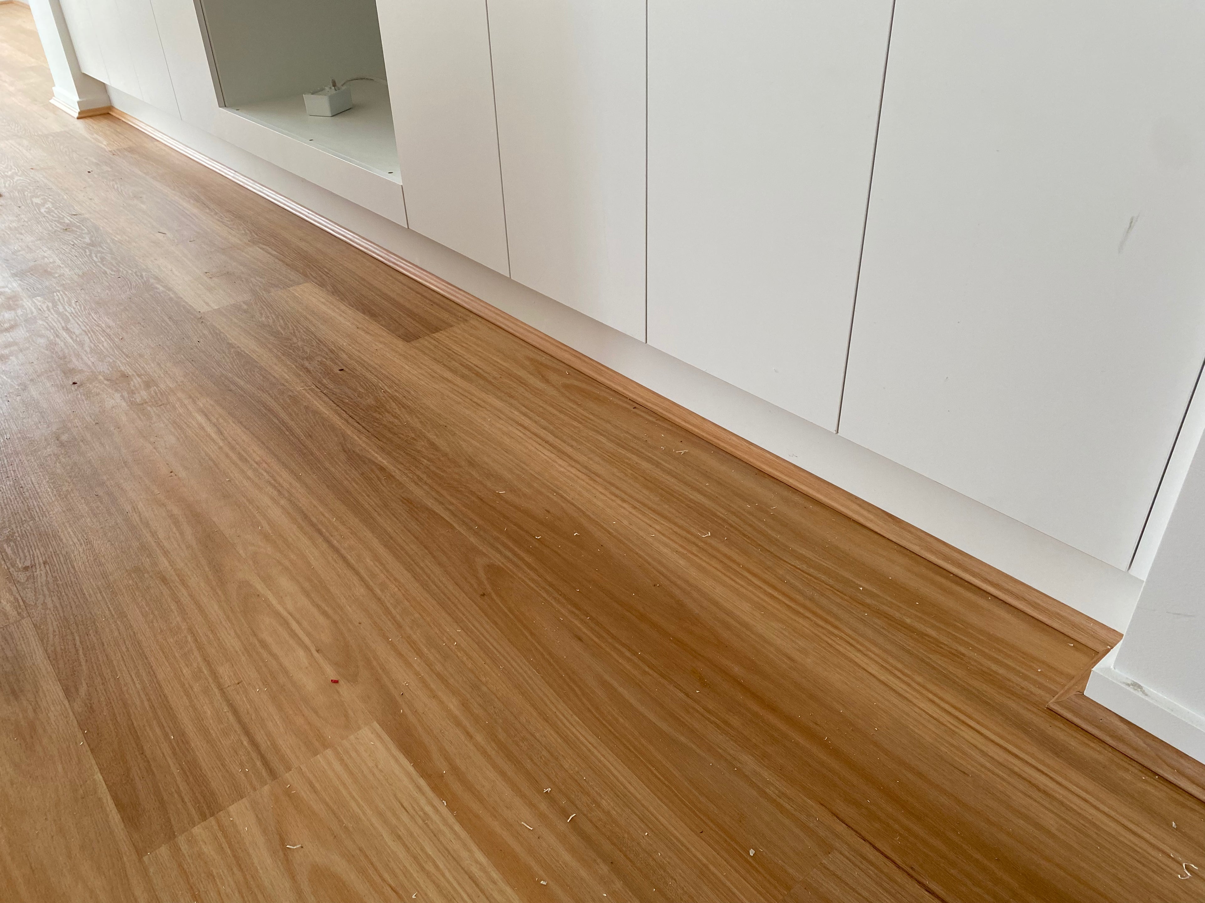 Installed room view of Natural Blackbutt SPC 9.5mm SPC hybrid flooring sample
