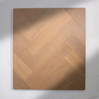 Perspective view of Light Malt Engineered Timber Herringbone 15.3mm in Light Malt colour light tone herringbone flooring sample