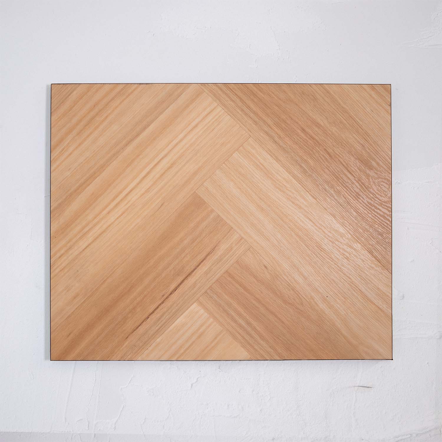 Detailed view of Natural Blackbutt SPC Hybrid Floorboards Herringbone 7.5+2mm in Natural Blackbutt colour dark shade herringbone flooring sample