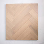 Angled view of Natural Limed Engineered Timber Herringbone 15.3mm in Natural Limed colour warm tone herringbone flooring sample