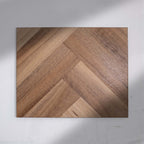 Angled view of Natural Spotted Gum SPC Hybrid Floorboards Herringbone 7.5+2mm in Natural Spotted colour warm tone herringbone flooring sample