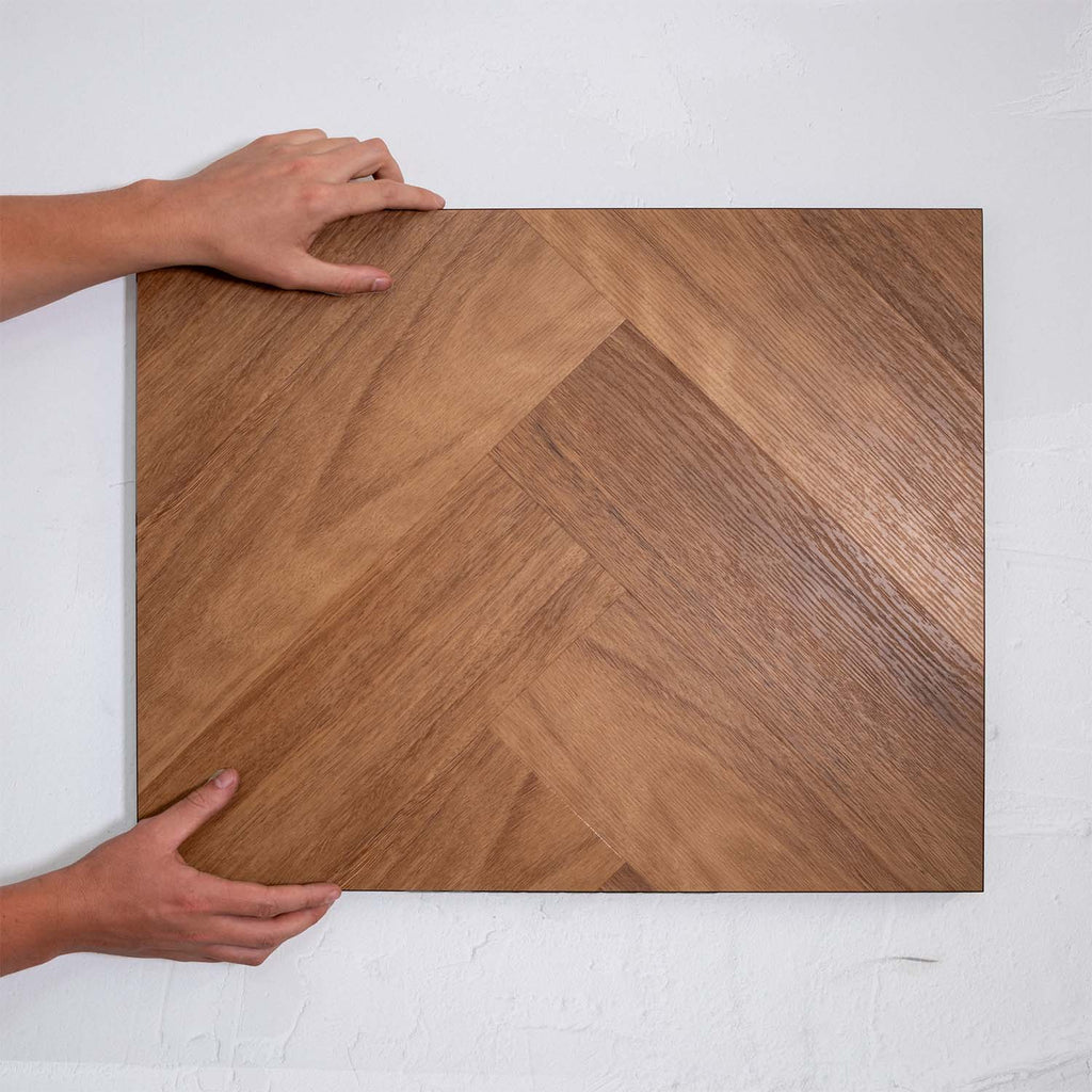 Top-down view of Pacific Spotted Gum SPC Hybrid Floorboards Herringbone 7.5+2mm in Pacific Spotted colour warm tone herringbone flooring sample