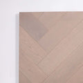 Perspective view of Pale Oak Engineered Timber Herringbone 15.3mm in Pale Oak colour warm tone herringbone flooring sample