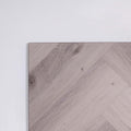 Side view of Snow Grey SPC Hybrid Floorboards Herringbone 7.5+2mm in Snow Grey colour light tone herringbone flooring sample